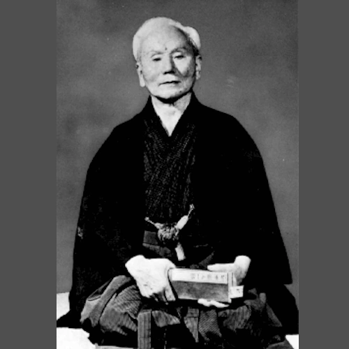 An old photo of Gichin Funakoshi, the founder of Shotokan
