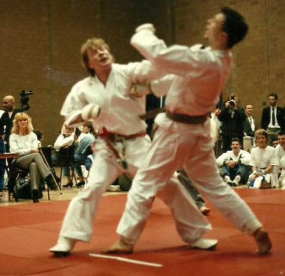 Sensei Fred competing in a tournament from the eighties, an action shot with him scoring a terrific point